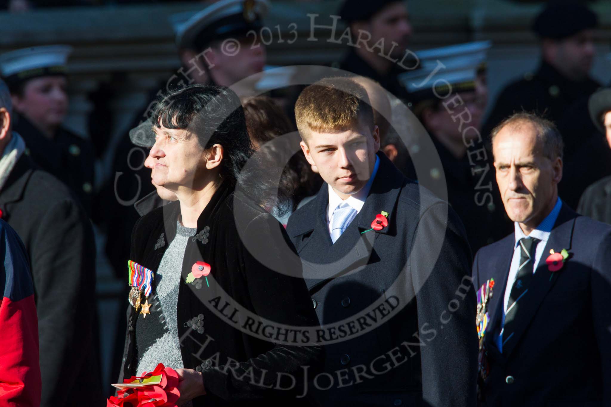 Photo 1411091218141D40029HaraldJoergens Remembrance Sunday at the Cenotaph in London 2014: Group M23 - Civilians Representing Families.
Press stand opposite the Foreign Office building, Whitehall, London SW1,
London,
Greater London,
United Kingdom,
on 09 November 2014 at 12:18, image #2167