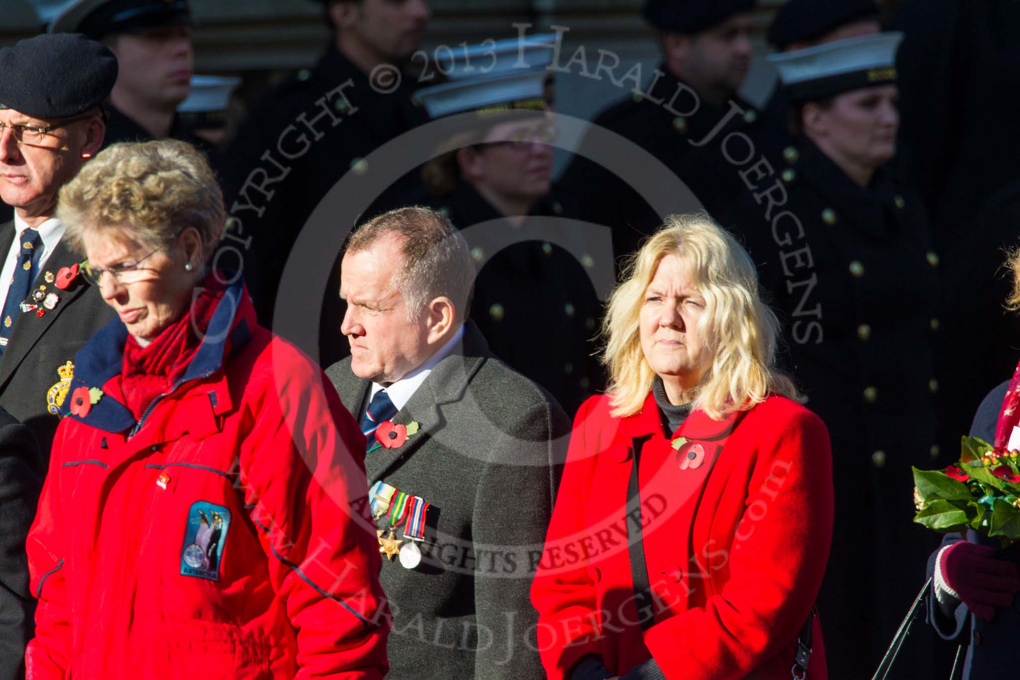 Remembrance Sunday at the Cenotaph in London 2014: Group M23 - Civilians Representing Families.
Press stand opposite the Foreign Office building, Whitehall, London SW1,
London,
Greater London,
United Kingdom,
on 09 November 2014 at 12:18, image #2174