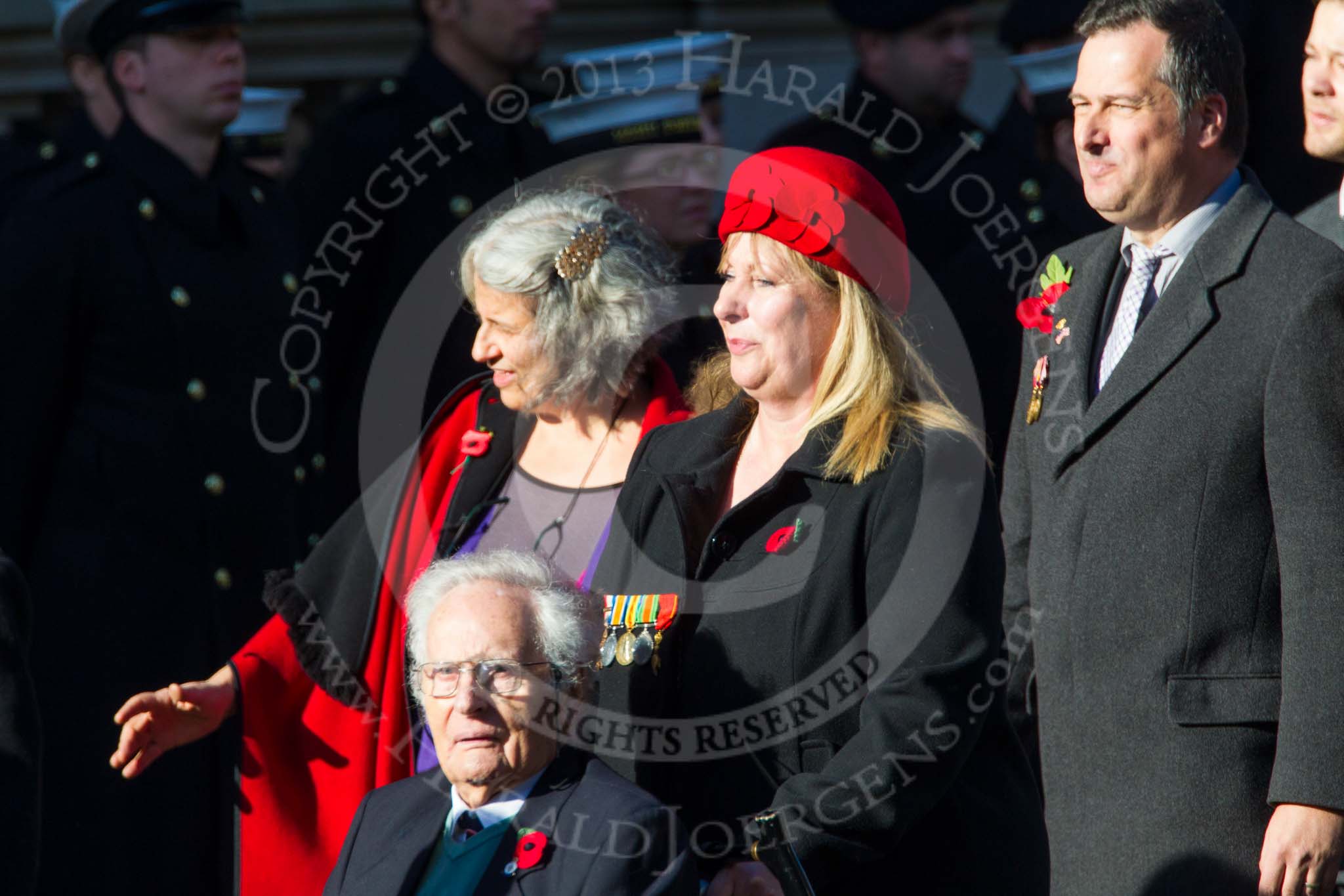 Remembrance Sunday at the Cenotaph in London 2014: Group M23 - Civilians Representing Families.
Press stand opposite the Foreign Office building, Whitehall, London SW1,
London,
Greater London,
United Kingdom,
on 09 November 2014 at 12:18, image #2178