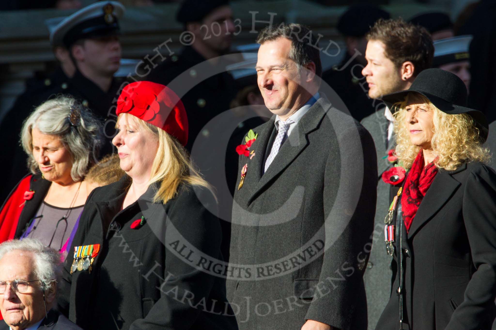 Remembrance Sunday at the Cenotaph in London 2014: Group M23 - Civilians Representing Families.
Press stand opposite the Foreign Office building, Whitehall, London SW1,
London,
Greater London,
United Kingdom,
on 09 November 2014 at 12:18, image #2179