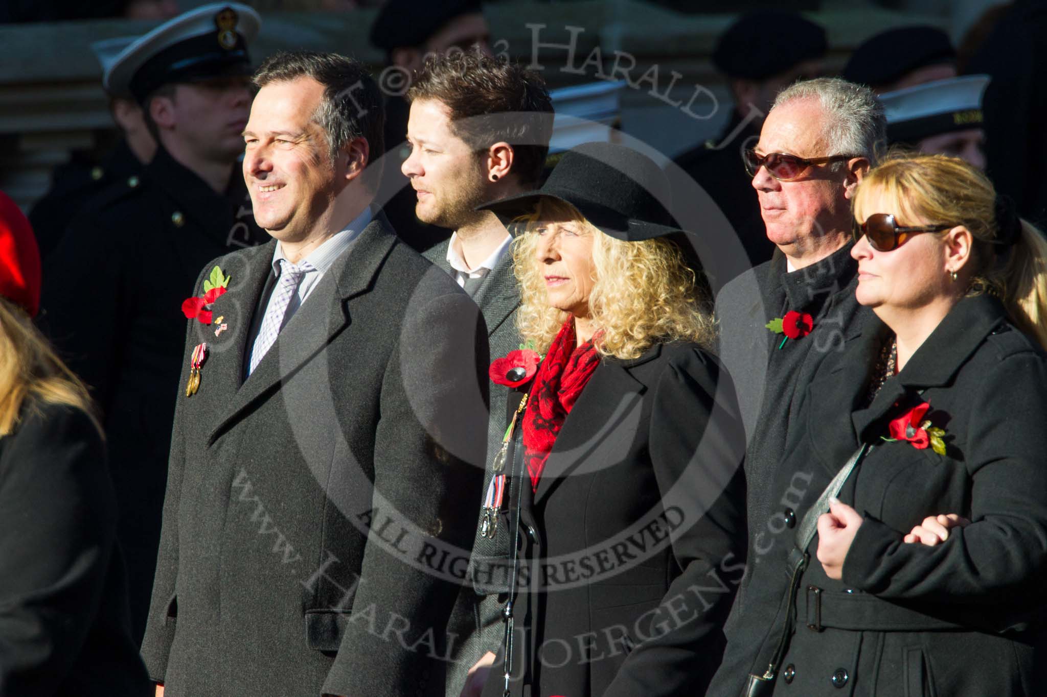 Photo 1411091218251D40057HaraldJoergens Remembrance Sunday at the Cenotaph in London 2014: Group M23 - Civilians Representing Families.
Press stand opposite the Foreign Office building, Whitehall, London SW1,
London,
Greater London,
United Kingdom,
on 09 November 2014 at 12:18, image #2180