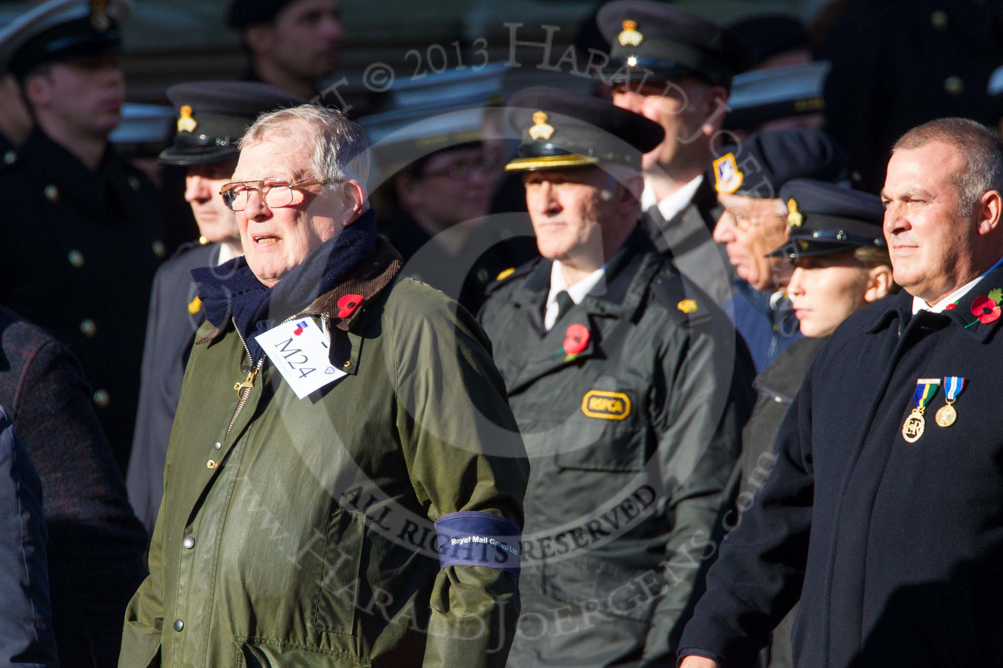 Remembrance Sunday at the Cenotaph in London 2014: Group M24 - Royal Mail Group Ltd.
Press stand opposite the Foreign Office building, Whitehall, London SW1,
London,
Greater London,
United Kingdom,
on 09 November 2014 at 12:18, image #2186