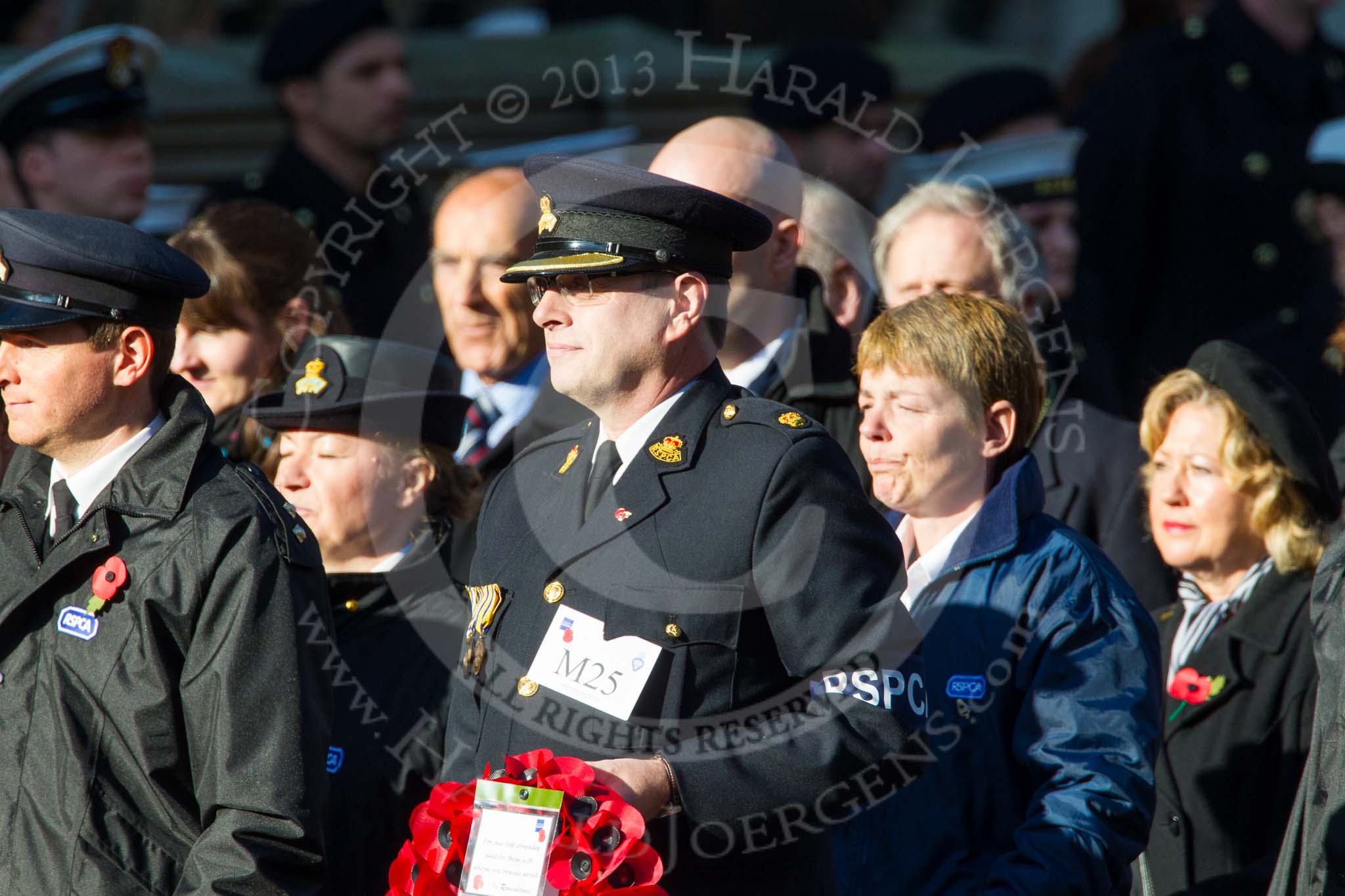 Remembrance Sunday at the Cenotaph in London 2014: Group M25 - Royal Society for the Prevention of Cruelty to Animals (RSPCA).
Press stand opposite the Foreign Office building, Whitehall, London SW1,
London,
Greater London,
United Kingdom,
on 09 November 2014 at 12:18, image #2190