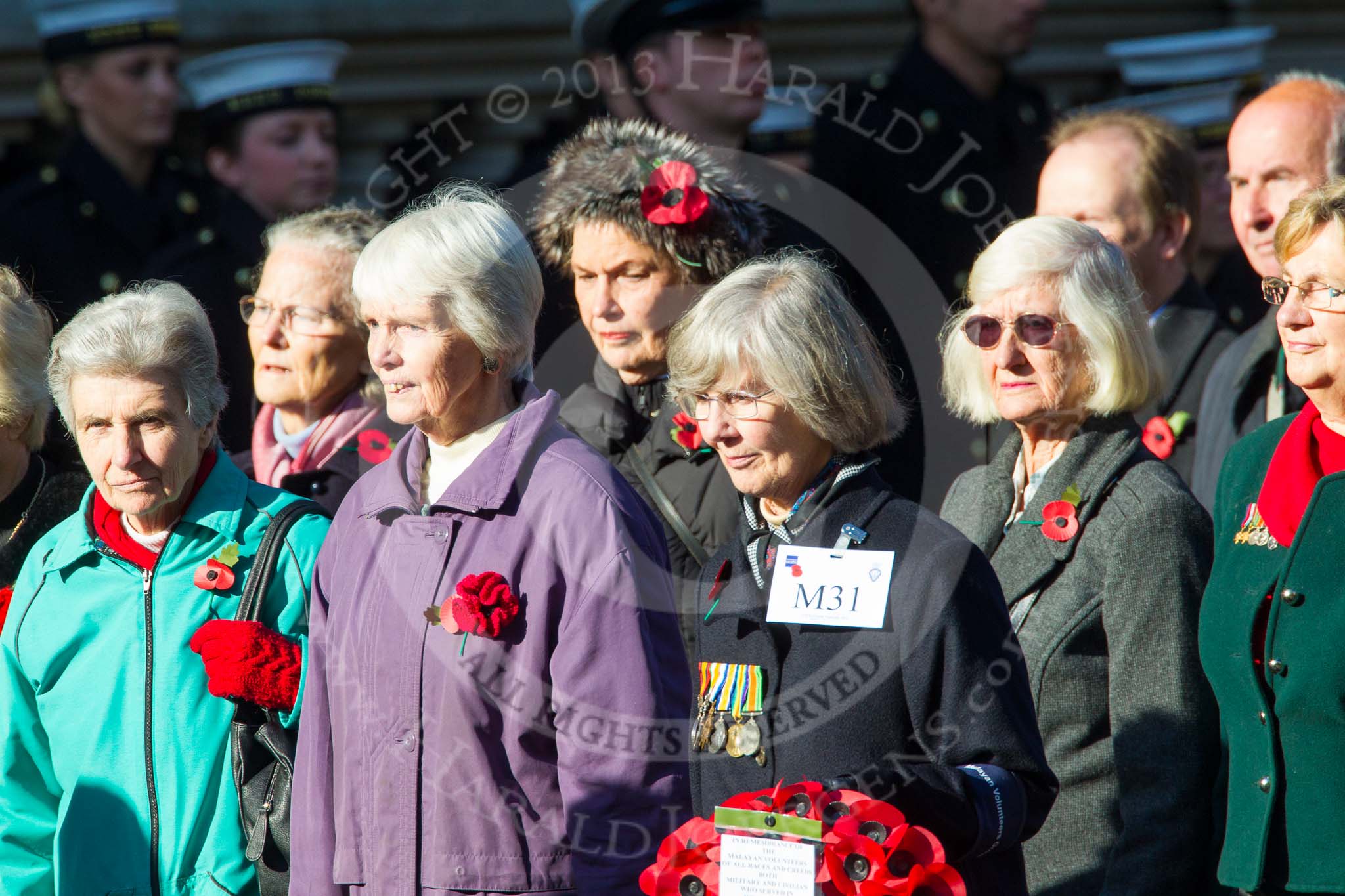 Remembrance Sunday at the Cenotaph in London 2014: Group M31 - Malayan Volunteers Group.
Press stand opposite the Foreign Office building, Whitehall, London SW1,
London,
Greater London,
United Kingdom,
on 09 November 2014 at 12:19, image #2229