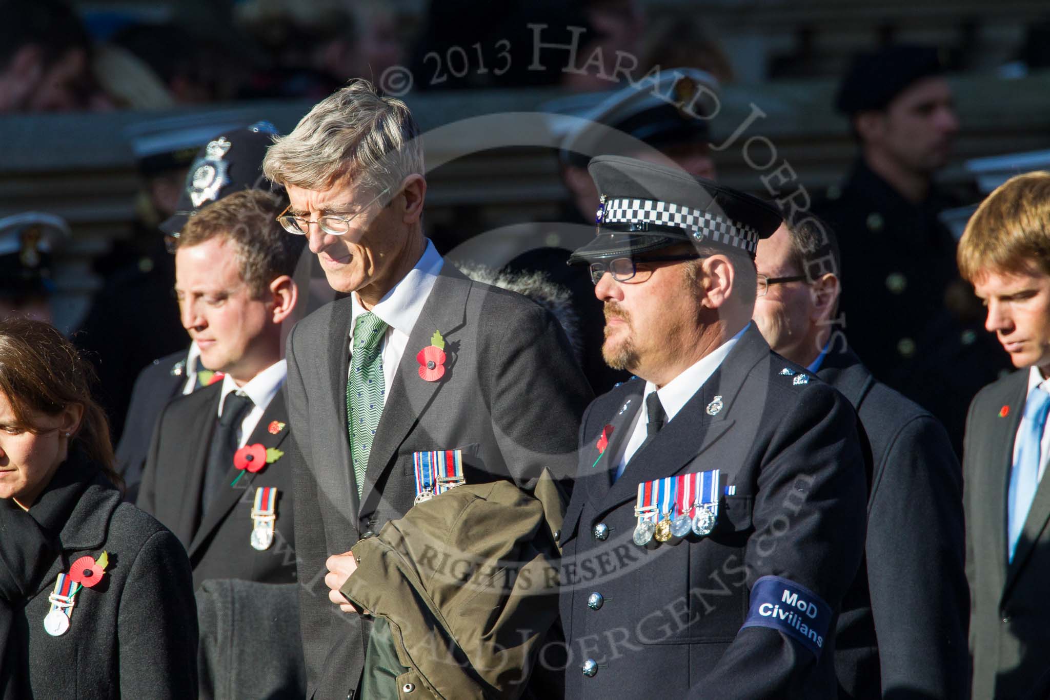 Remembrance Sunday at the Cenotaph in London 2014: Group M33 - Ministry of Defence (MoD) Civilians.
Press stand opposite the Foreign Office building, Whitehall, London SW1,
London,
Greater London,
United Kingdom,
on 09 November 2014 at 12:19, image #2236