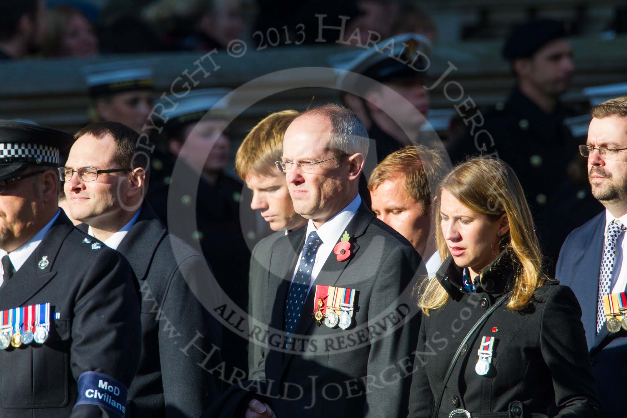 Remembrance Sunday at the Cenotaph in London 2014: Group M33 - Ministry of Defence (MoD) Civilians.
Press stand opposite the Foreign Office building, Whitehall, London SW1,
London,
Greater London,
United Kingdom,
on 09 November 2014 at 12:19, image #2237