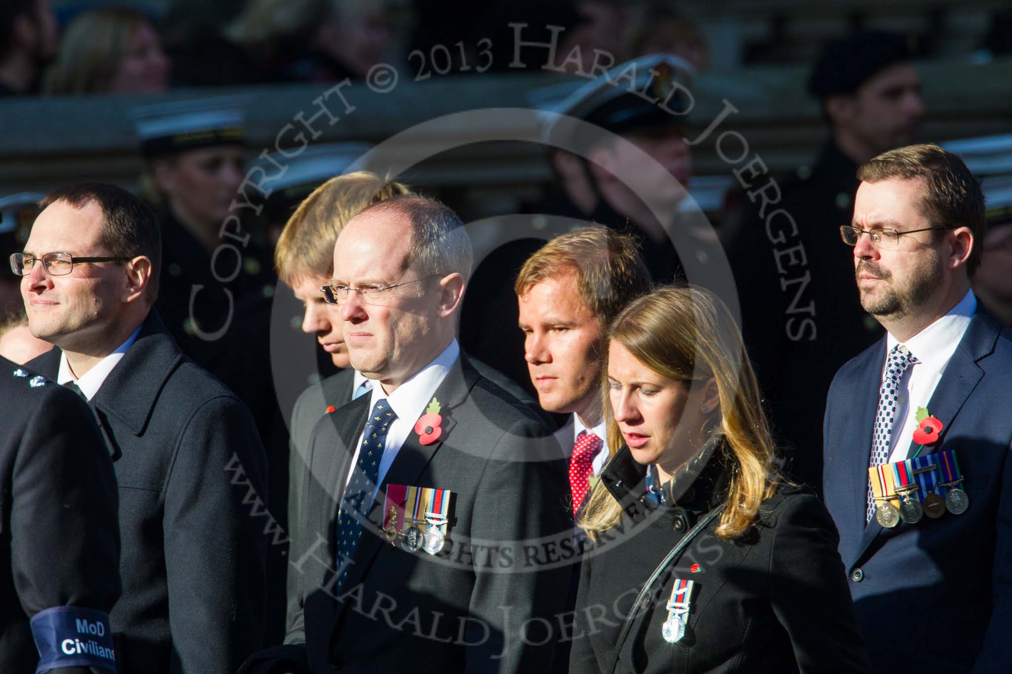 Remembrance Sunday at the Cenotaph in London 2014: Group M33 - Ministry of Defence (MoD) Civilians.
Press stand opposite the Foreign Office building, Whitehall, London SW1,
London,
Greater London,
United Kingdom,
on 09 November 2014 at 12:19, image #2238