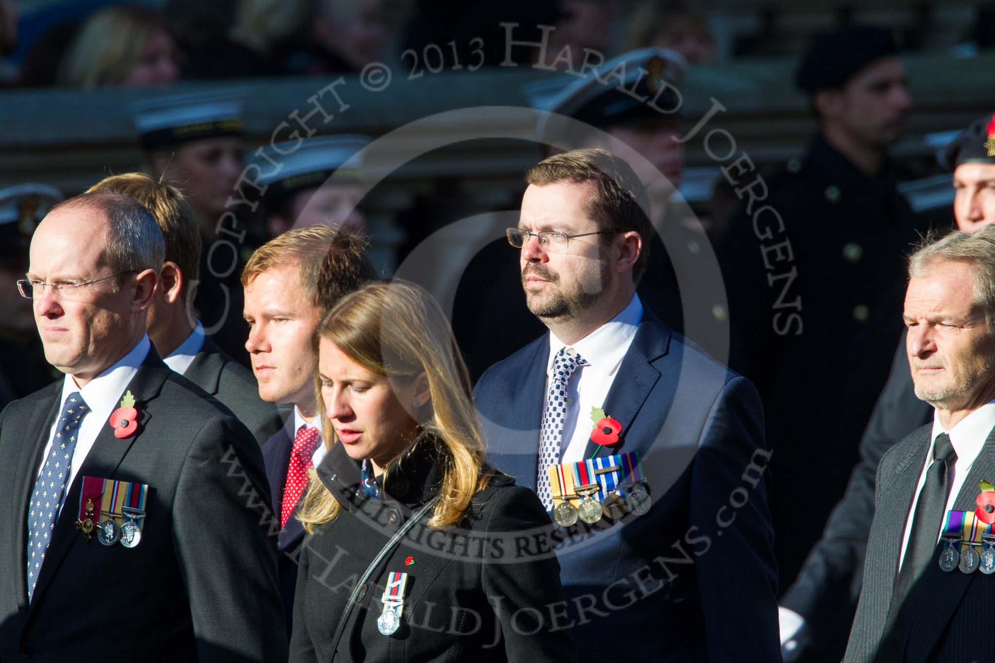 Remembrance Sunday at the Cenotaph in London 2014: Group M33 - Ministry of Defence (MoD) Civilians.
Press stand opposite the Foreign Office building, Whitehall, London SW1,
London,
Greater London,
United Kingdom,
on 09 November 2014 at 12:19, image #2239