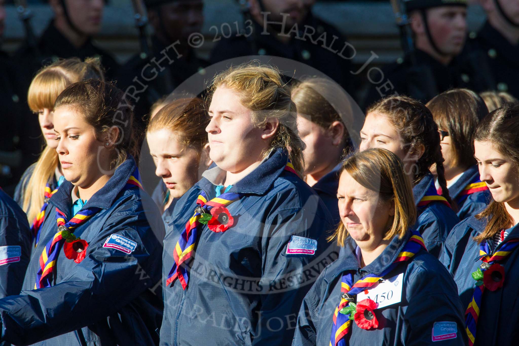 Remembrance Sunday at the Cenotaph in London 2014: Group M50 - Girlguiding London & South East England.
Press stand opposite the Foreign Office building, Whitehall, London SW1,
London,
Greater London,
United Kingdom,
on 09 November 2014 at 12:21, image #2318