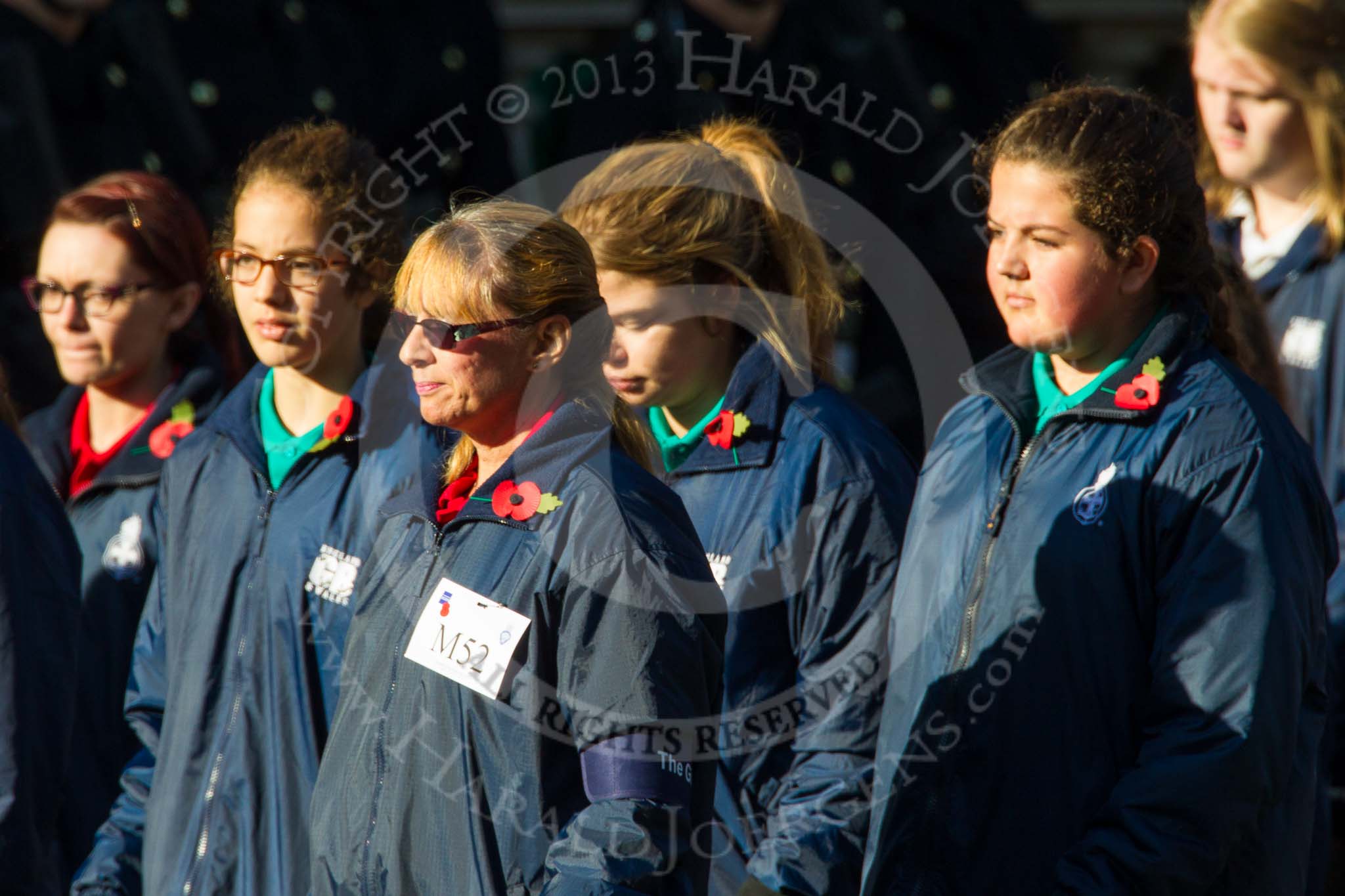 Remembrance Sunday at the Cenotaph in London 2014: Group M52 - Girls Brigade England & Wales.
Press stand opposite the Foreign Office building, Whitehall, London SW1,
London,
Greater London,
United Kingdom,
on 09 November 2014 at 12:21, image #2334