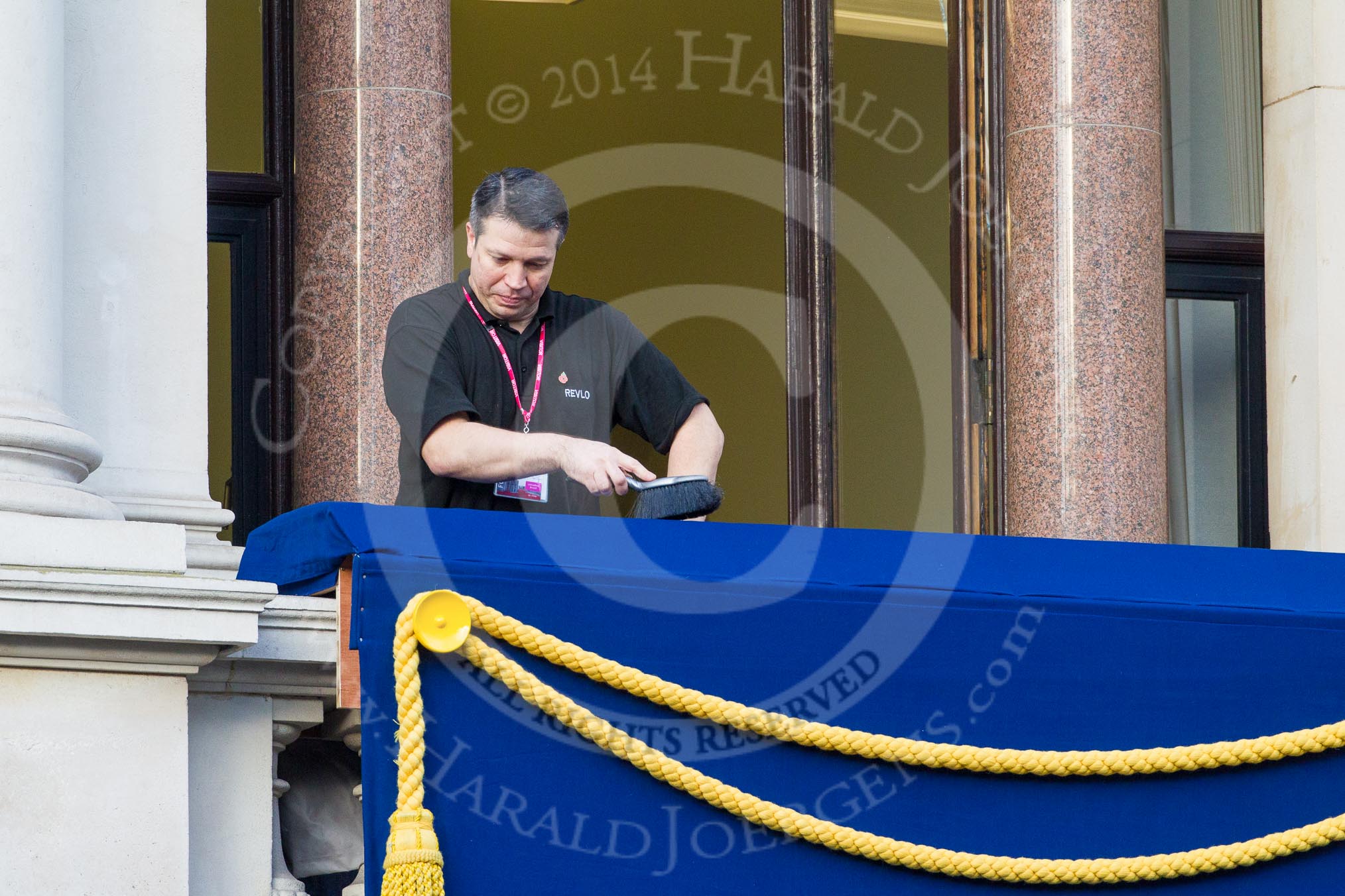 Remembrance Sunday at the Cenotaph in London 2014: Preparations for the event - the balconies are cleaned before the arrival of the official guests..
Press stand opposite the Foreign Office building, Whitehall, London SW1,
London,
Greater London,
United Kingdom,
on 09 November 2014 at 08:19, image #6