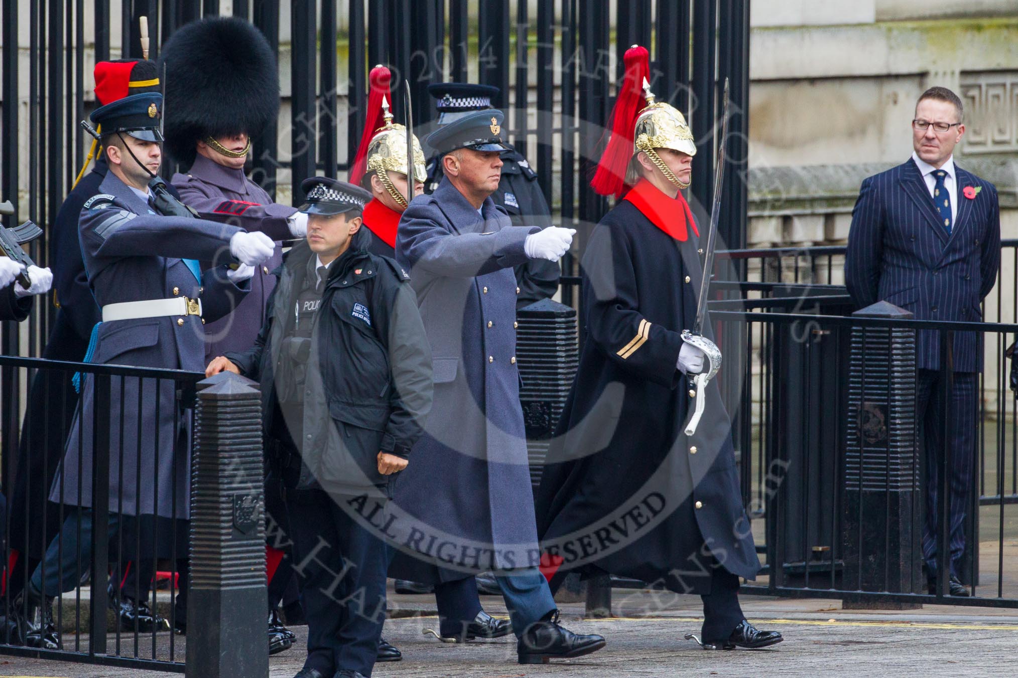 Remembrance Sunday at the Cenotaph in London 2014: The "marker detail personell" leaving Downing Street to mark the positions for the armed forces detachments that will line Whitehall.
Press stand opposite the Foreign Office building, Whitehall, London SW1,
London,
Greater London,
United Kingdom,
on 09 November 2014 at 10:06, image #24