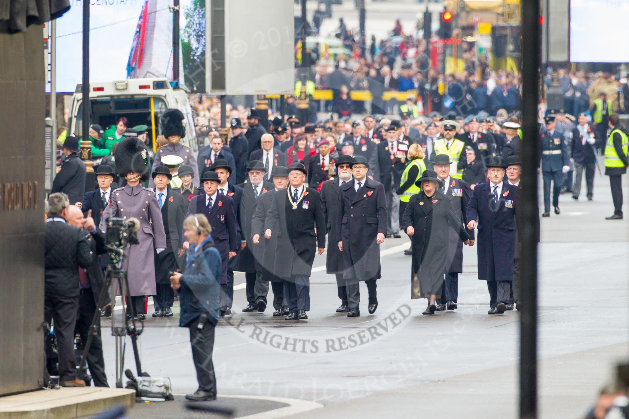 Remembrance Sunday at the Cenotaph in London 2014: The first column of veterans arrives at Whitehall. All the veterans gather at Horse Guards Parade before the event..
Press stand opposite the Foreign Office building, Whitehall, London SW1,
London,
Greater London,
United Kingdom,
on 09 November 2014 at 10:15, image #27