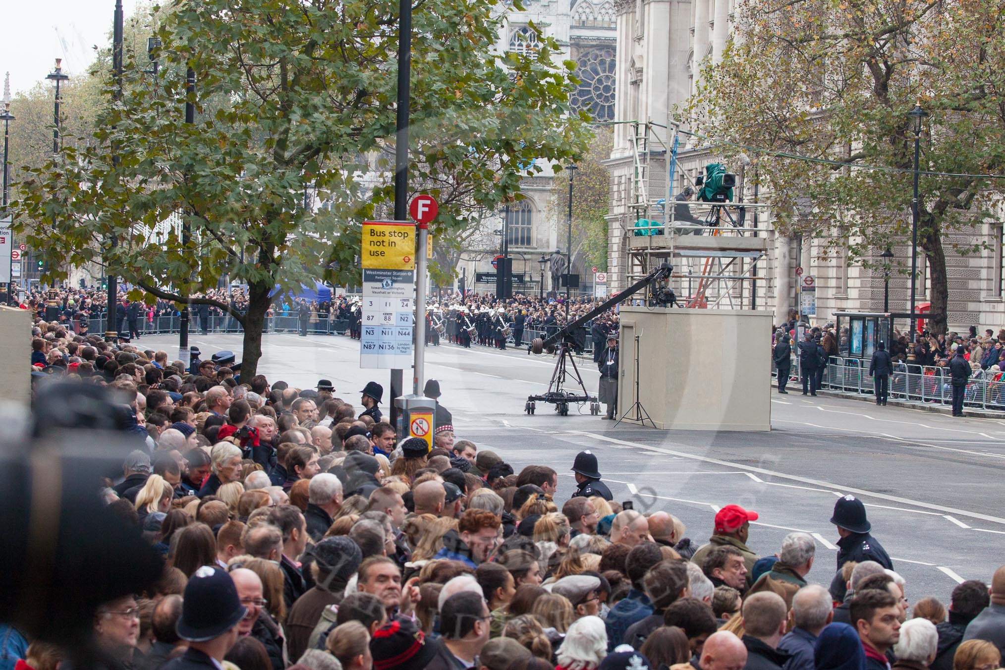 Remembrance Sunday at the Cenotaph in London 2014: The first band, the Band of the Royal Marines, arrives at the western side of Whitehall..
Press stand opposite the Foreign Office building, Whitehall, London SW1,
London,
Greater London,
United Kingdom,
on 09 November 2014 at 10:16, image #28