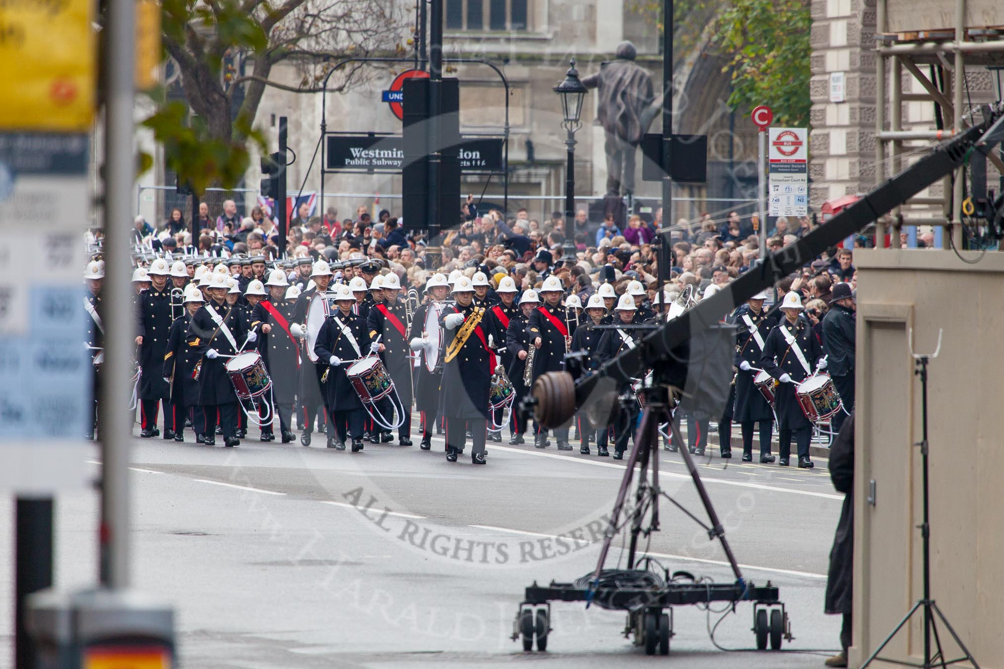 Remembrance Sunday at the Cenotaph in London 2014: The first band, the Band of the Royal Marines, arrives at the western side of Whitehall..
Press stand opposite the Foreign Office building, Whitehall, London SW1,
London,
Greater London,
United Kingdom,
on 09 November 2014 at 10:16, image #29