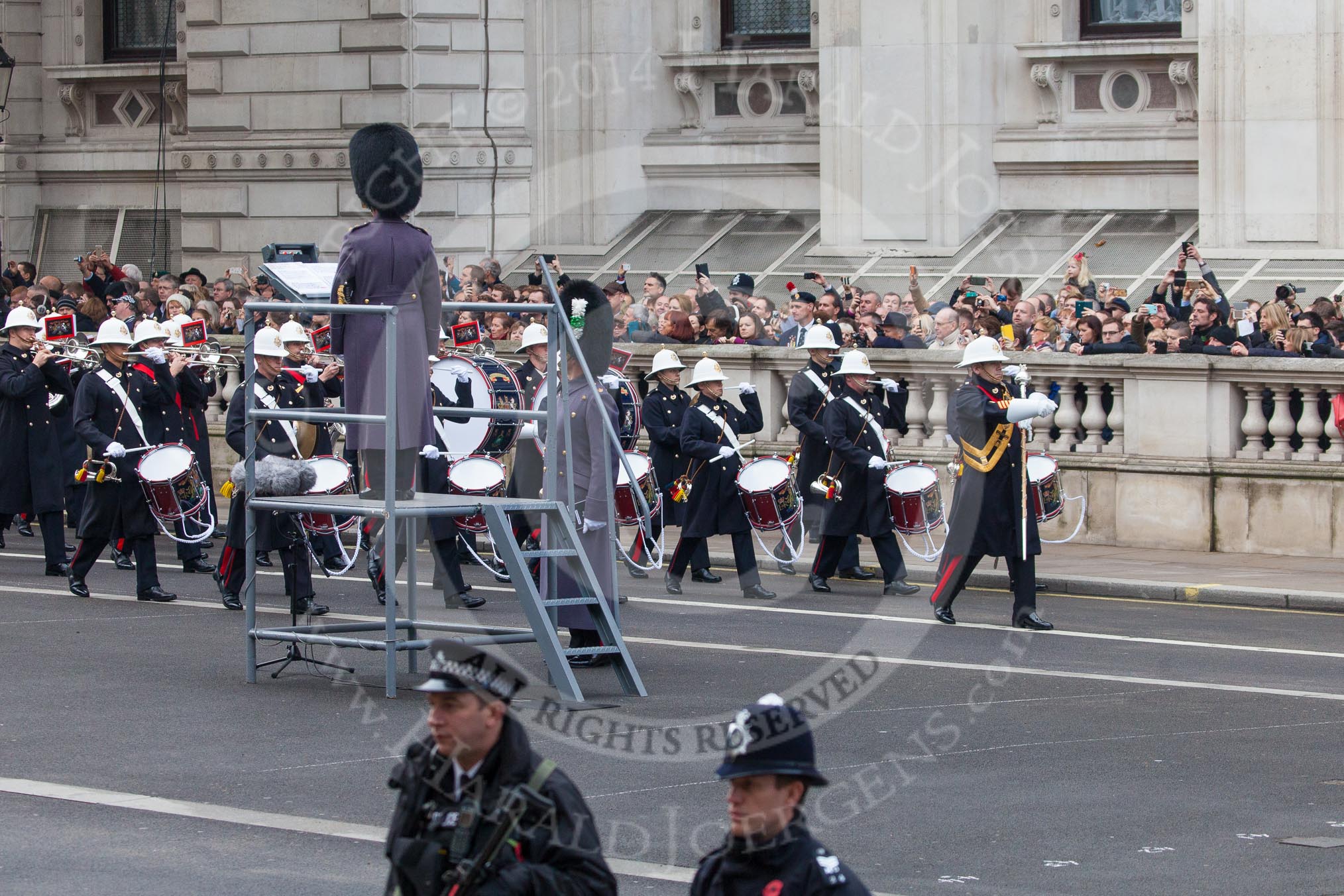 Remembrance Sunday at the Cenotaph in London 2014: The Band of the Royal Marines marching past the Director of Music.
Press stand opposite the Foreign Office building, Whitehall, London SW1,
London,
Greater London,
United Kingdom,
on 09 November 2014 at 10:17, image #33