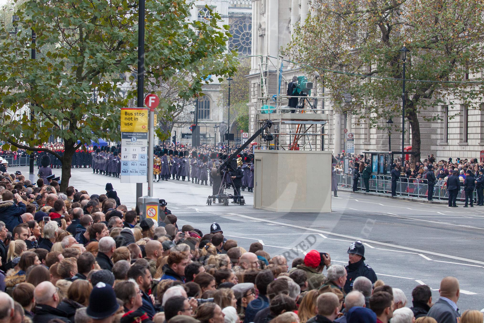 Remembrance Sunday at the Cenotaph in London 2014: The BBC camera tower in the middle of Whitehall, the Massed Bands of the Household Division are marching towards the Cenotaph.
Press stand opposite the Foreign Office building, Whitehall, London SW1,
London,
Greater London,
United Kingdom,
on 09 November 2014 at 10:23, image #56
