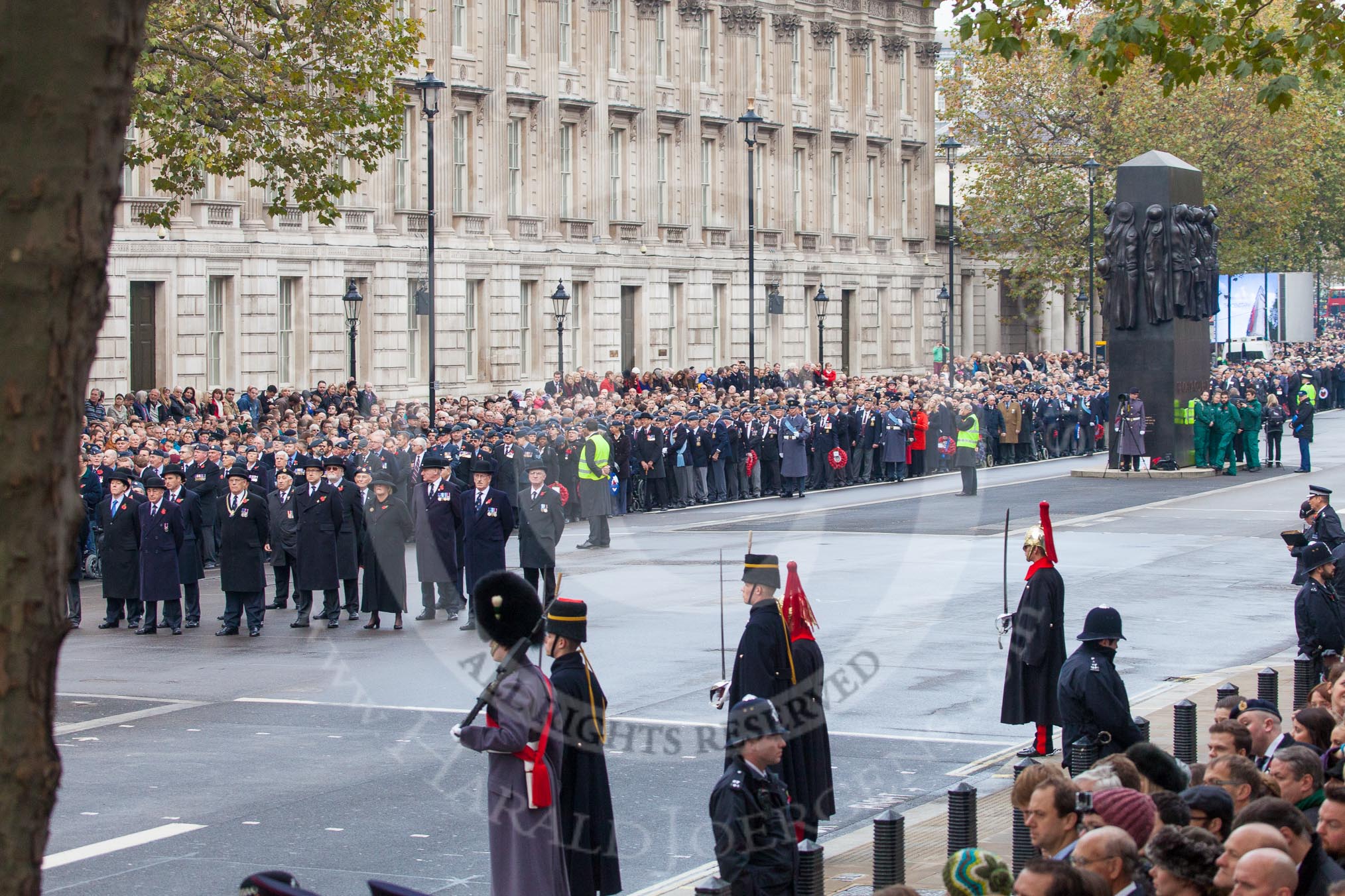 Remembrance Sunday at the Cenotaph in London 2014: The representatives of the major charities, behind them, alongside the memorial of Women in World War II, the first column of veterans waiting for the March Past.
Press stand opposite the Foreign Office building, Whitehall, London SW1,
London,
Greater London,
United Kingdom,
on 09 November 2014 at 10:25, image #60
