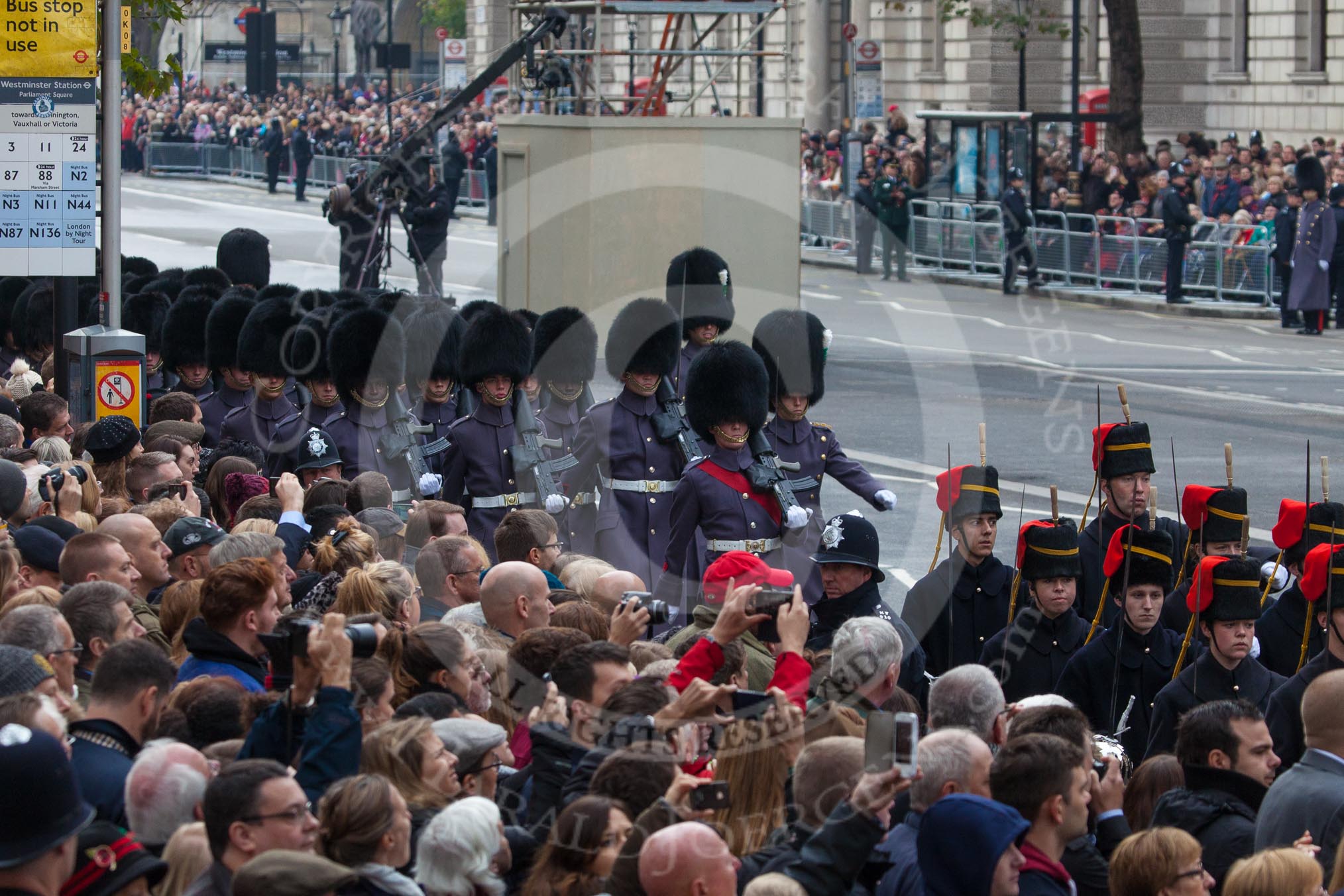 Remembrance Sunday at the Cenotaph in London 2014: The detachment of the Household Division Welsh Guards arrives at Whitehall. In front of them the King's Troop Royal Horse Artillery.
Press stand opposite the Foreign Office building, Whitehall, London SW1,
London,
Greater London,
United Kingdom,
on 09 November 2014 at 10:25, image #63
