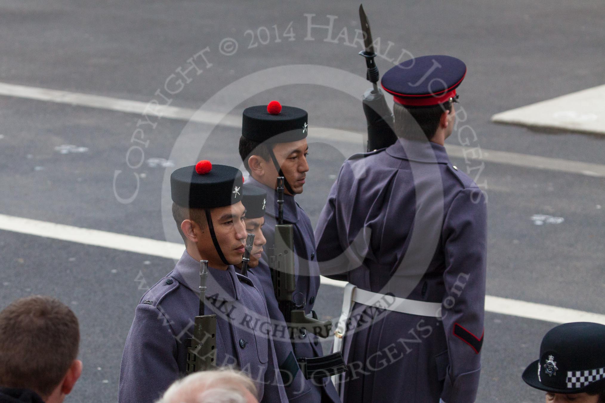 Remembrance Sunday at the Cenotaph in London 2014: The detachment of the  Royal Gurkha Rifles marching towards their position on the eastern side of Whitehall.
Press stand opposite the Foreign Office building, Whitehall, London SW1,
London,
Greater London,
United Kingdom,
on 09 November 2014 at 10:26, image #65