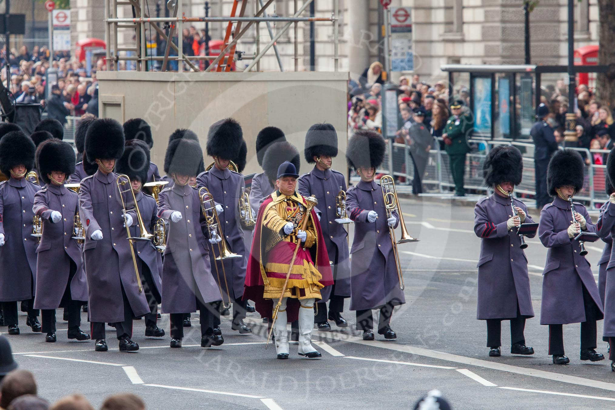 Remembrance Sunday at the Cenotaph in London 2014: Drum Major Stephen Staite, Grenadier Guards, leading another band onto Whitehall.
Press stand opposite the Foreign Office building, Whitehall, London SW1,
London,
Greater London,
United Kingdom,
on 09 November 2014 at 10:29, image #68