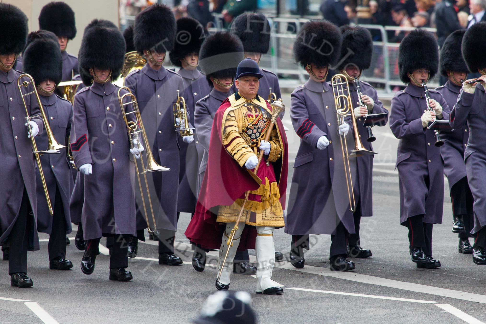 Remembrance Sunday at the Cenotaph in London 2014: Drum Major Stephen Staite, Grenadier Guards, leading another band onto Whitehall.
Press stand opposite the Foreign Office building, Whitehall, London SW1,
London,
Greater London,
United Kingdom,
on 09 November 2014 at 10:29, image #69