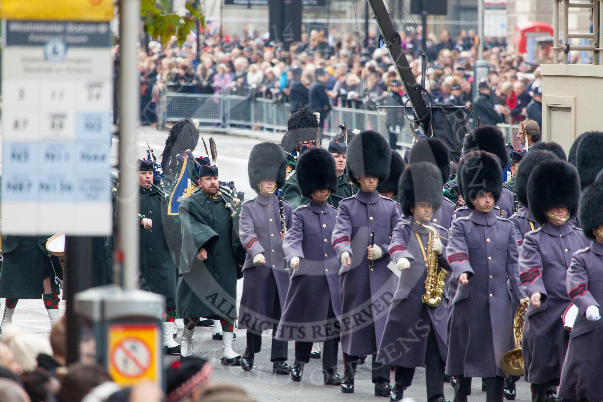 Remembrance Sunday at the Cenotaph in London 2014: A household Divison band is followed by the Pipes and Drums.
Press stand opposite the Foreign Office building, Whitehall, London SW1,
London,
Greater London,
United Kingdom,
on 09 November 2014 at 10:29, image #70