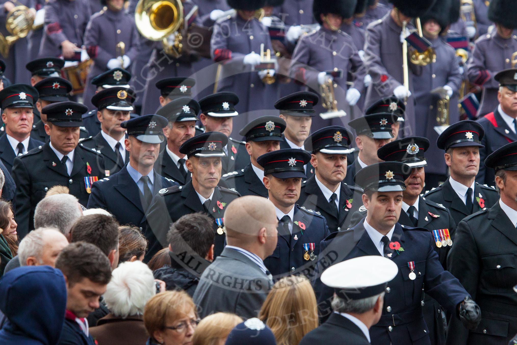 Remembrance Sunday at the Cenotaph in London 2014: A detachment of the Civil Services (Fire Brigade?) arriving at Whitehall.
Press stand opposite the Foreign Office building, Whitehall, London SW1,
London,
Greater London,
United Kingdom,
on 09 November 2014 at 10:31, image #75