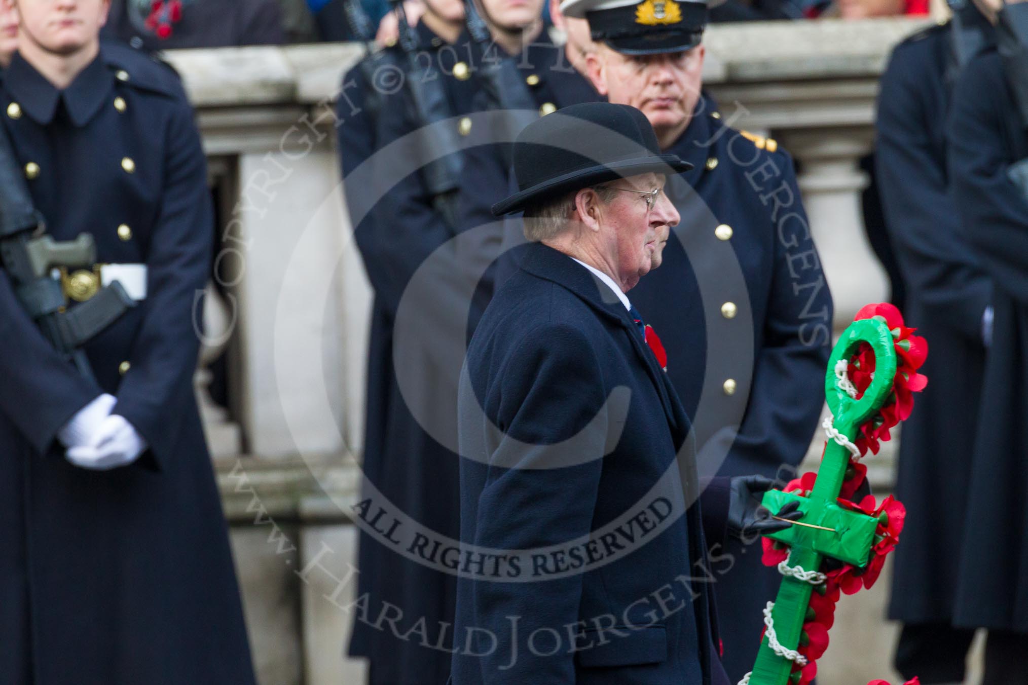 Remembrance Sunday at the Cenotaph in London 2014: The heads of the Royal Navy Association with their wreath.
Press stand opposite the Foreign Office building, Whitehall, London SW1,
London,
Greater London,
United Kingdom,
on 09 November 2014 at 10:40, image #83