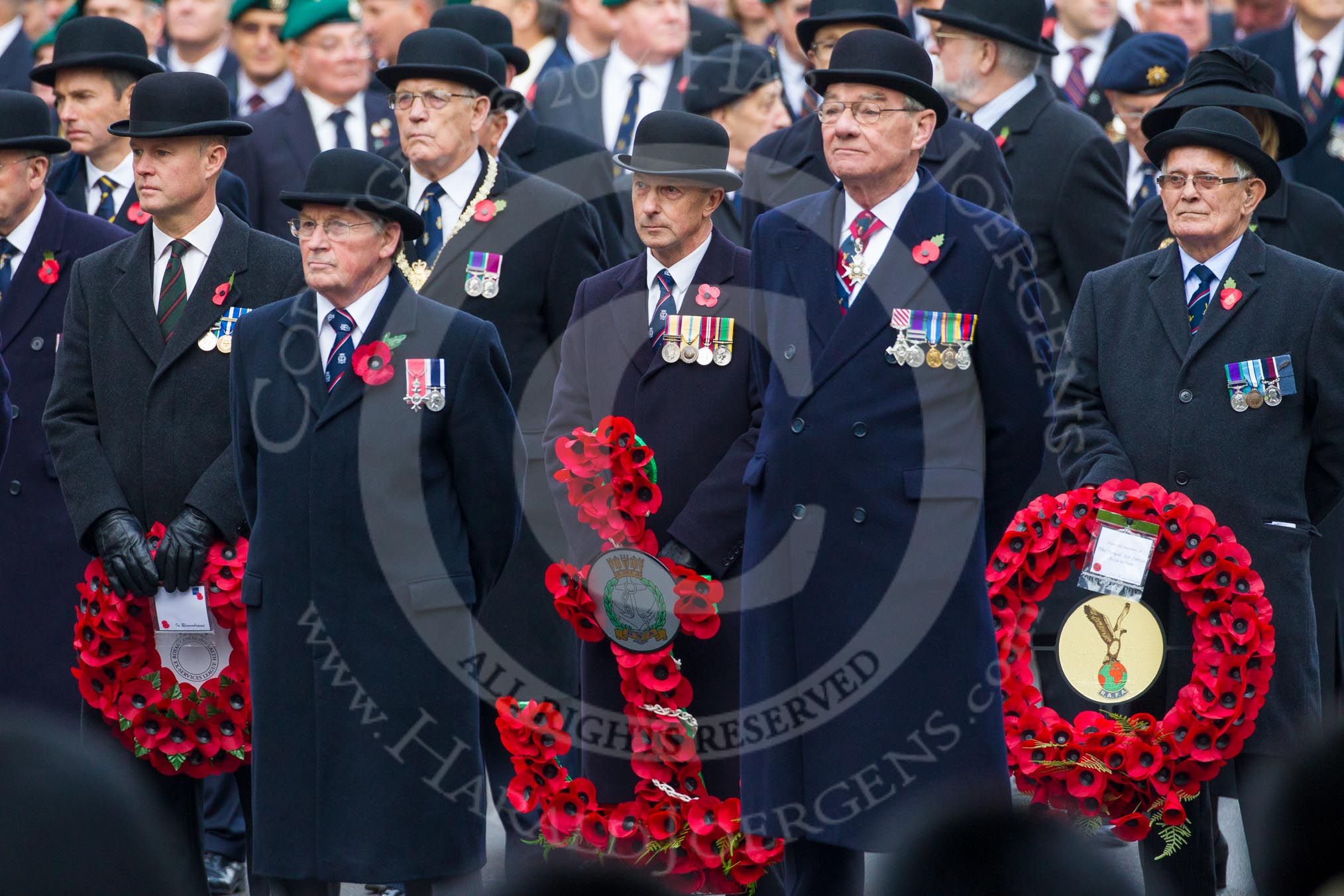 Remembrance Sunday at the Cenotaph in London 2014: Representatives of the major charities that will lay a wreath later - the Royal Commonwealth Ex-Services League, the Royal Navy Association, and the Royal Air Force Association.
Press stand opposite the Foreign Office building, Whitehall, London SW1,
London,
Greater London,
United Kingdom,
on 09 November 2014 at 10:42, image #86