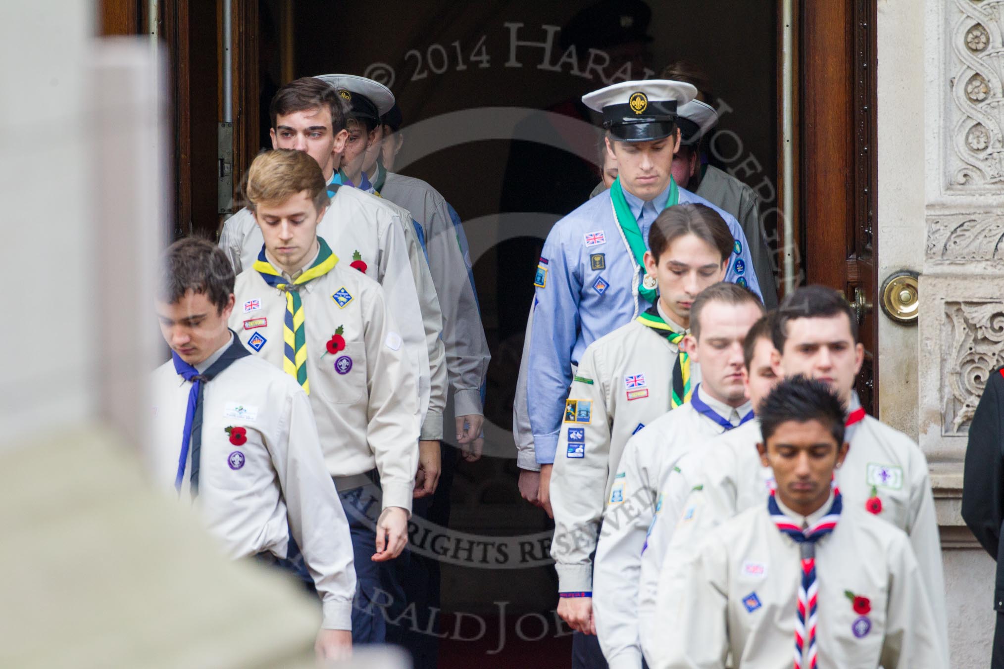 Remembrance Sunday at the Cenotaph in London 2014: The Queen's Scouts emerging from the Foreign- and Commonwealth Office to form a Guard of Honour.
Press stand opposite the Foreign Office building, Whitehall, London SW1,
London,
Greater London,
United Kingdom,
on 09 November 2014 at 10:45, image #89