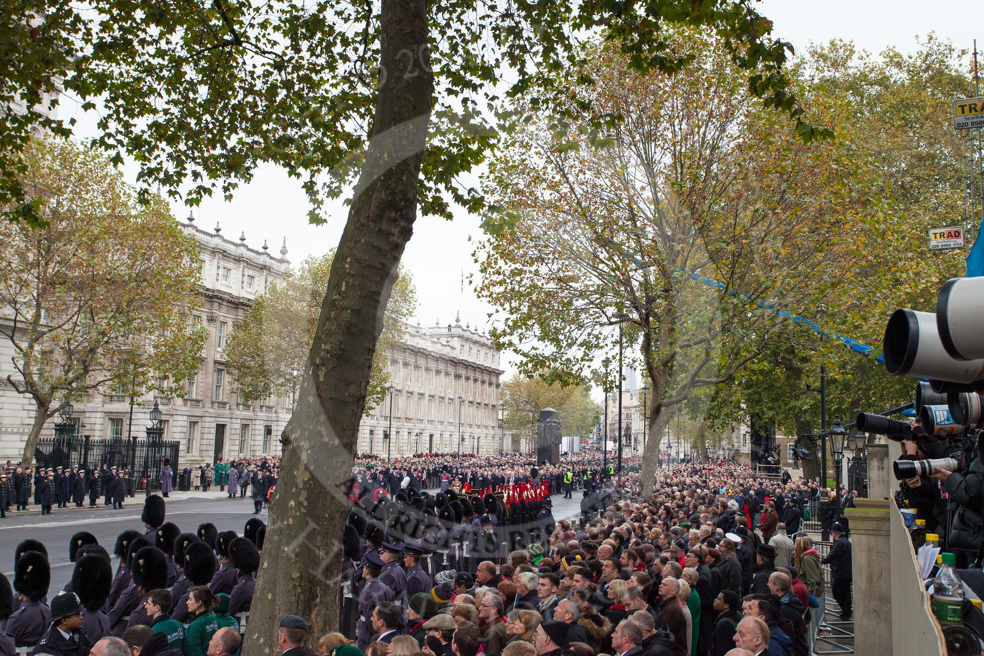 Remembrance Sunday at the Cenotaph in London 2014: Whitehall before the event, lines with large numbers of spectators and over ten thousand veterans waiting for the March Past.
Press stand opposite the Foreign Office building, Whitehall, London SW1,
London,
Greater London,
United Kingdom,
on 09 November 2014 at 10:53, image #93