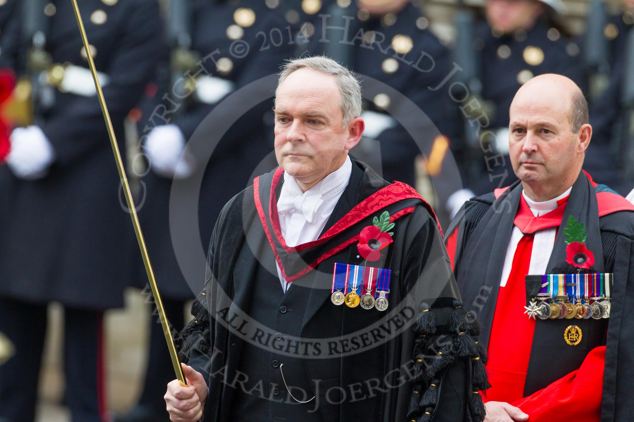 Remembrance Sunday at the Cenotaph in London 2014: The Serjeant of the Vestry, David Baldwin, followed by the Chaplain General to HM Land Forces, Reverend Dr David George Coulter.
Press stand opposite the Foreign Office building, Whitehall, London SW1,
London,
Greater London,
United Kingdom,
on 09 November 2014 at 10:54, image #110