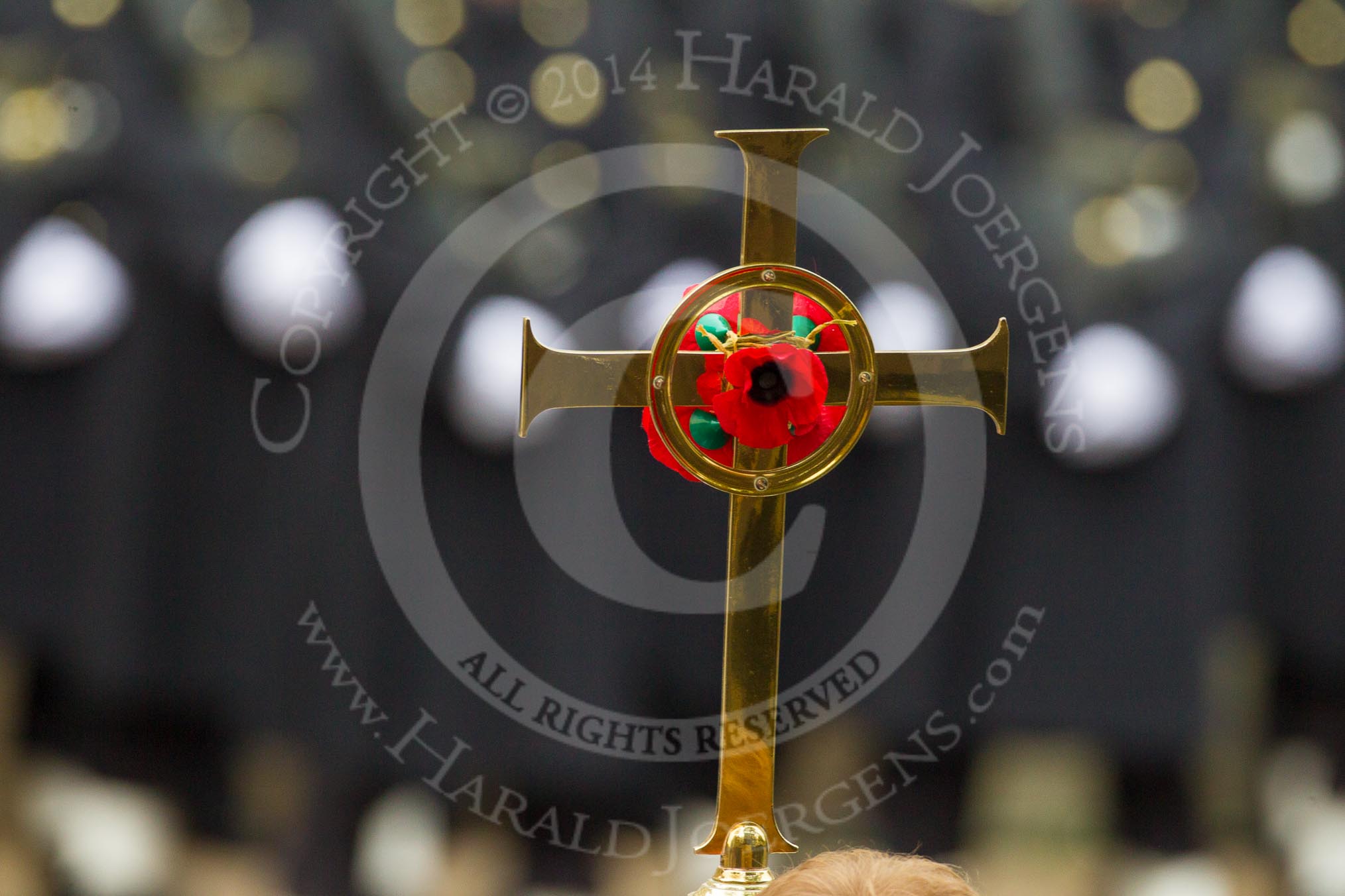 Remembrance Sunday at the Cenotaph in London 2014: The golden cross with the red poppies.
Press stand opposite the Foreign Office building, Whitehall, London SW1,
London,
Greater London,
United Kingdom,
on 09 November 2014 at 10:54, image #119