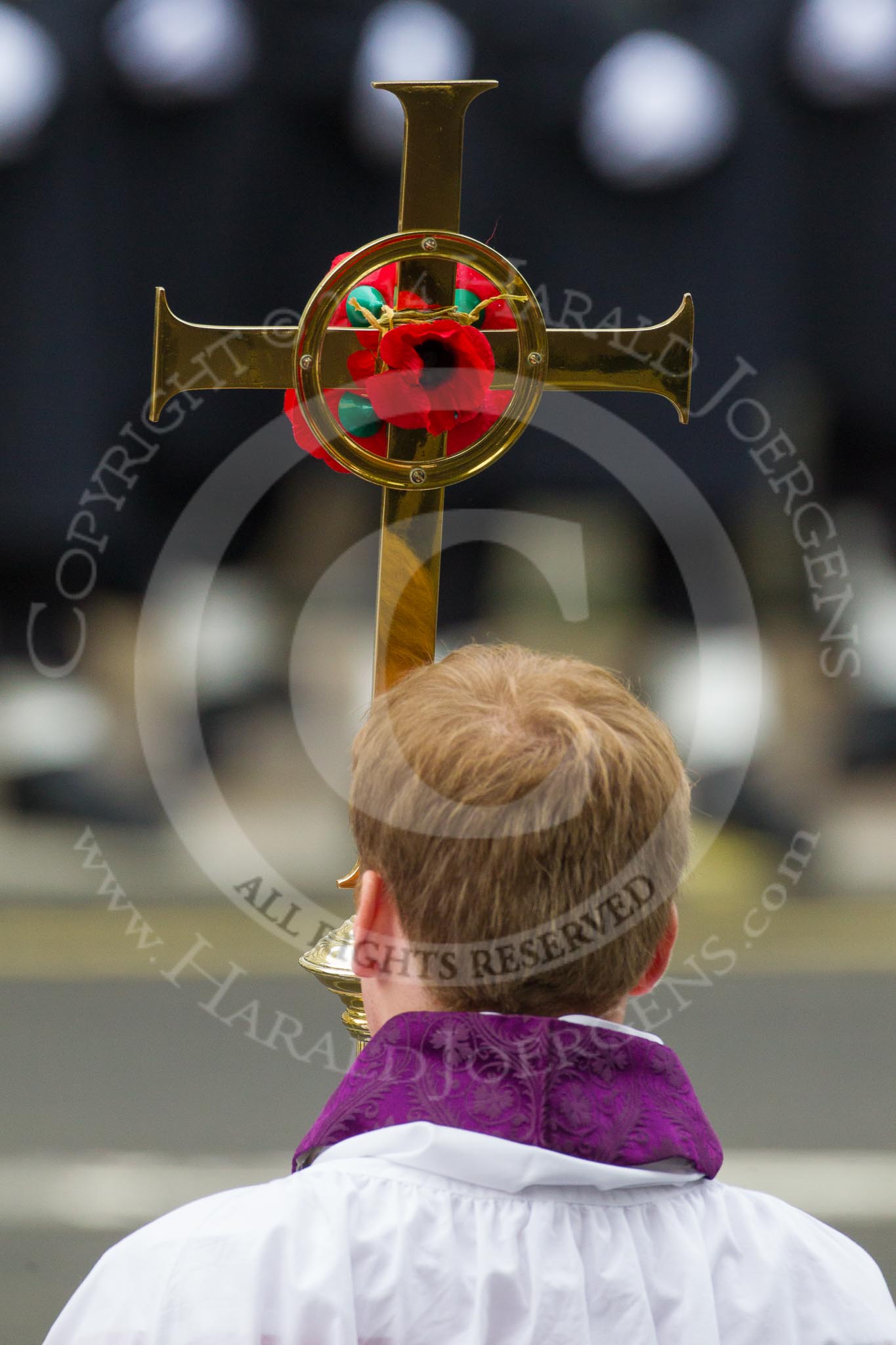 Remembrance Sunday at the Cenotaph in London 2014: The cross bearer with the cross.
Press stand opposite the Foreign Office building, Whitehall, London SW1,
London,
Greater London,
United Kingdom,
on 09 November 2014 at 10:55, image #120