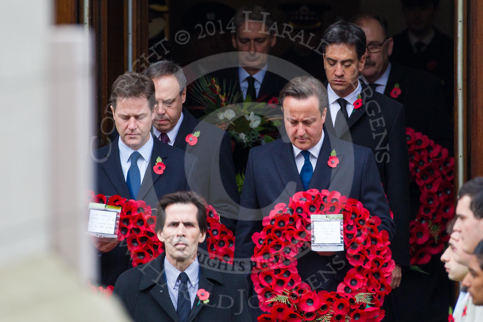 Photo 1411091055401D43669HaraldJoergens Remembrance Sunday at the Cenotaph in London 2014: The politicians emerging from the door of the Foreign- and Commonwealth Office - Nick Clegg and David Cameron, behind them Nigel Dodds and Ed Milliband.
Press stand opposite the Foreign Office building, Whitehall, London SW1,
London,
Greater London,
United Kingdom,
on 09 November 2014 at 10:55, image #122