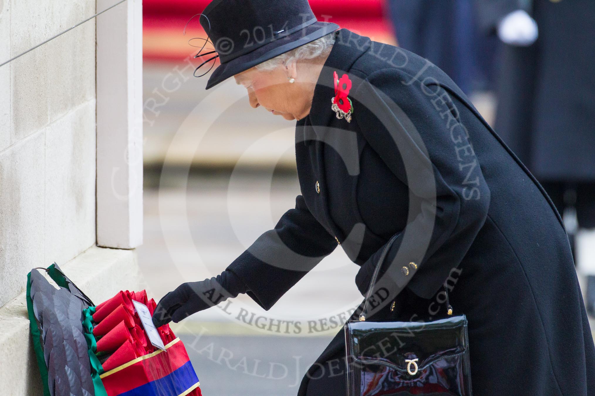 Remembrance Sunday at the Cenotaph in London 2014: HM The Queen laying her wreath at the Cenotaph.
Press stand opposite the Foreign Office building, Whitehall, London SW1,
London,
Greater London,
United Kingdom,
on 09 November 2014 at 11:03, image #188