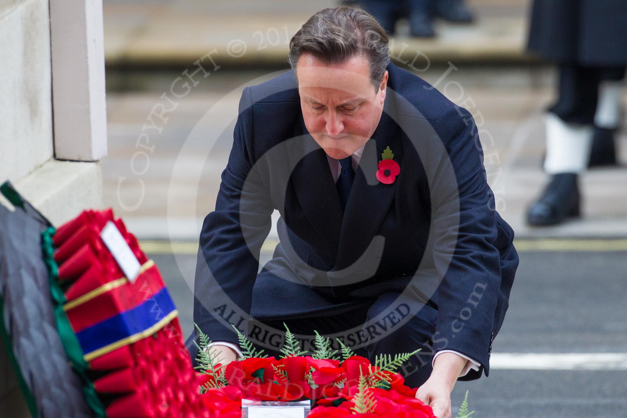 Remembrance Sunday at the Cenotaph in London 2014: The Prime Minister, the Rt Hon David Cameron, laying a wreath at the Cenotaph.
Press stand opposite the Foreign Office building, Whitehall, London SW1,
London,
Greater London,
United Kingdom,
on 09 November 2014 at 11:07, image #219