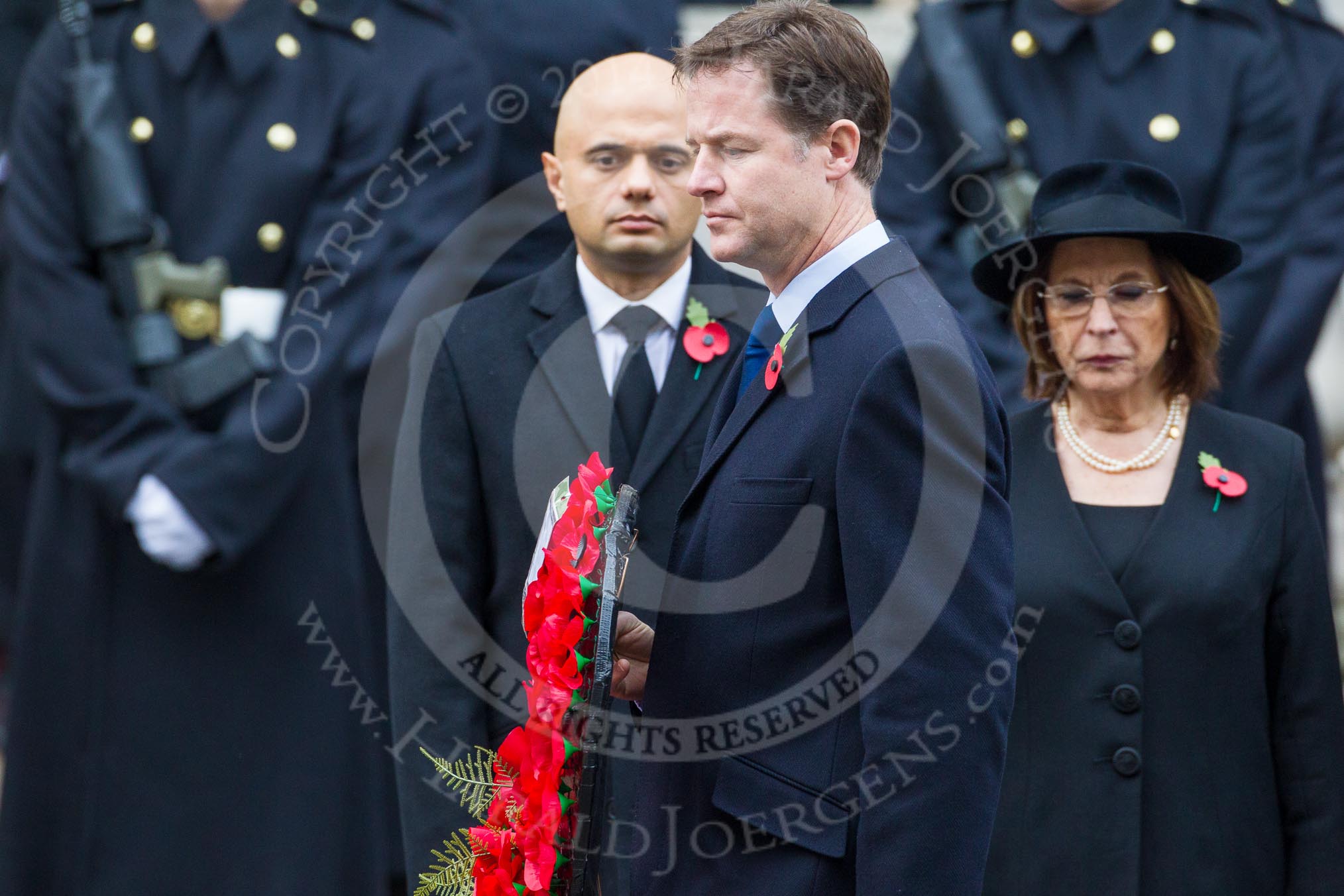 Remembrance Sunday at the Cenotaph in London 2014: The leader of the Liberal Demicrats, Nick Clegg, walking towards the Cenotaph with his wreath.
Press stand opposite the Foreign Office building, Whitehall, London SW1,
London,
Greater London,
United Kingdom,
on 09 November 2014 at 11:07, image #223