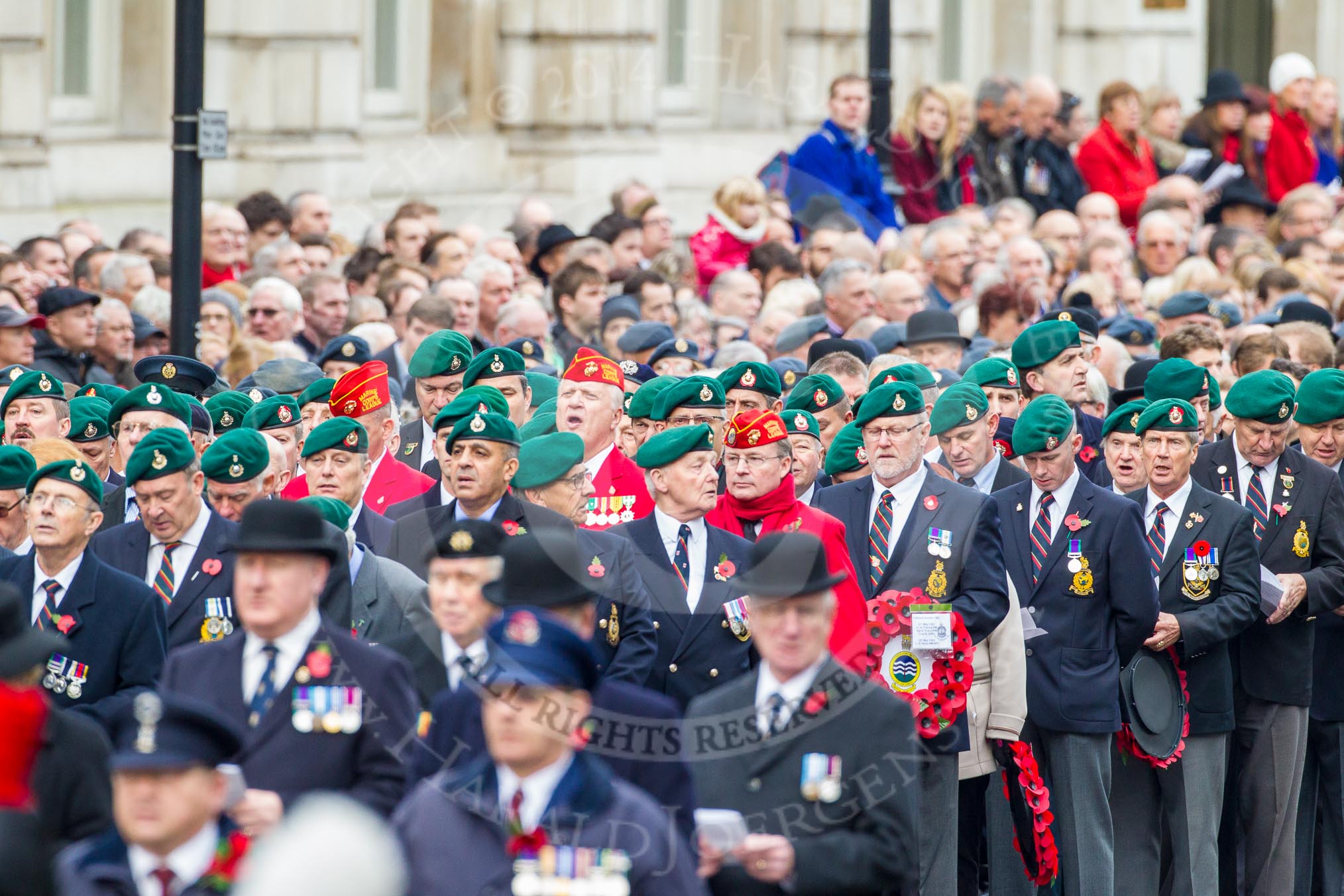 Remembrance Sunday at the Cenotaph in London 2014: Veterans waiting for the March Past singing during the service.
Press stand opposite the Foreign Office building, Whitehall, London SW1,
London,
Greater London,
United Kingdom,
on 09 November 2014 at 11:18, image #284