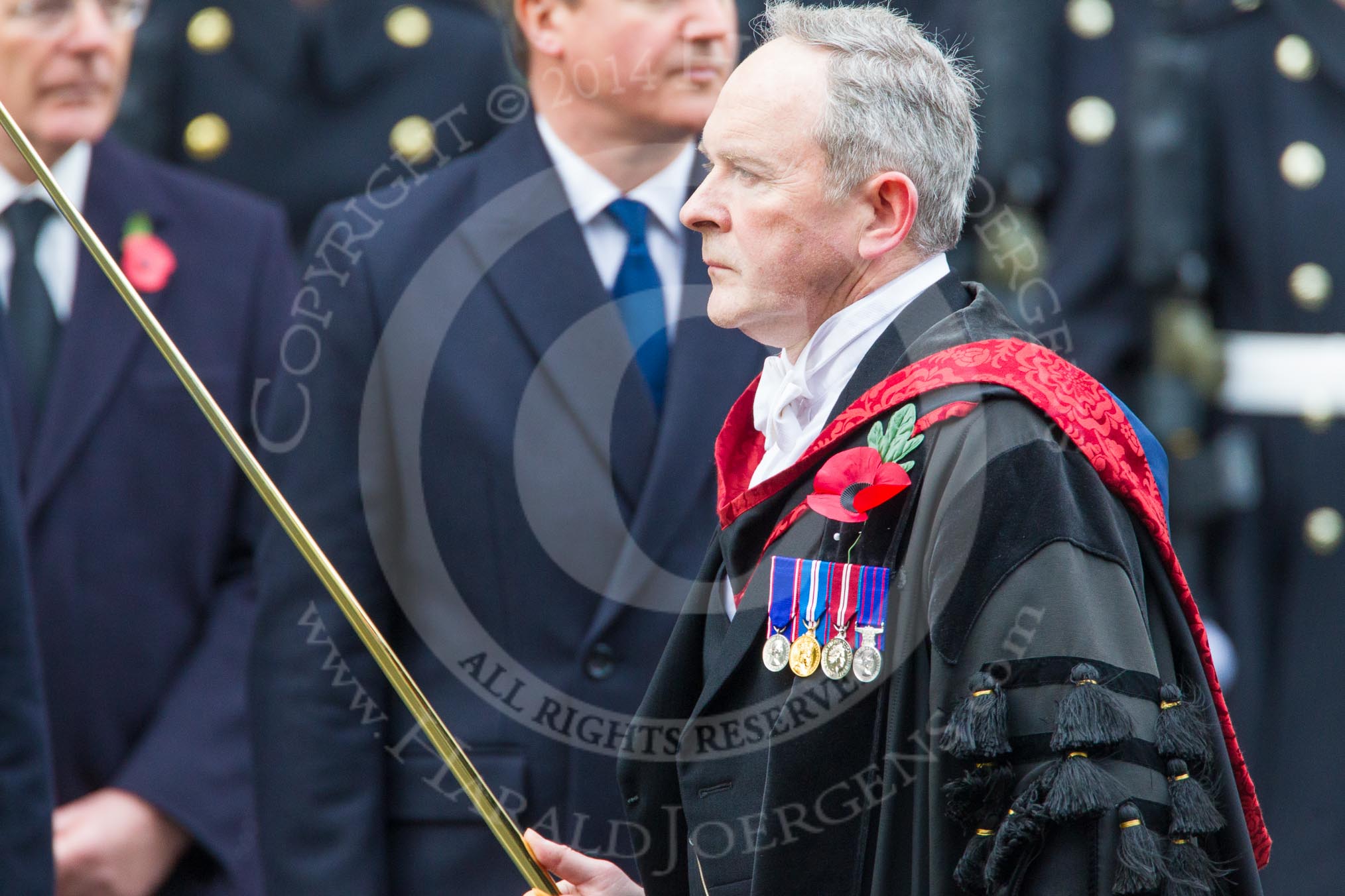 Remembrance Sunday at the Cenotaph in London 2014: David Baldwin , the Serjeant of the Vestry, on the way back to the Foreign- and Commonwealth Office.
Press stand opposite the Foreign Office building, Whitehall, London SW1,
London,
Greater London,
United Kingdom,
on 09 November 2014 at 11:22, image #297