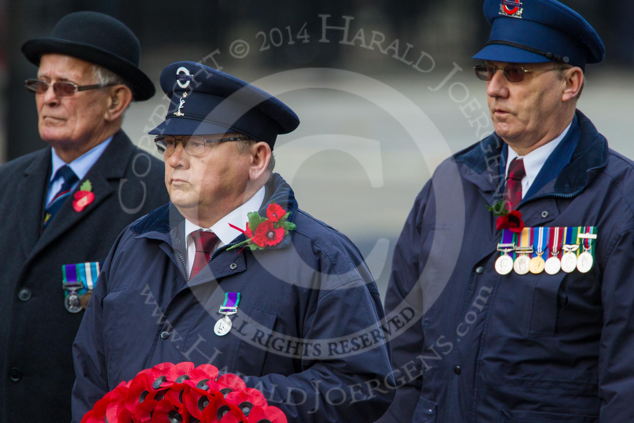 Remembrance Sunday at the Cenotaph in London 2014: The representative of Transport for London with his wreath.
Press stand opposite the Foreign Office building, Whitehall, London SW1,
London,
Greater London,
United Kingdom,
on 09 November 2014 at 11:26, image #310