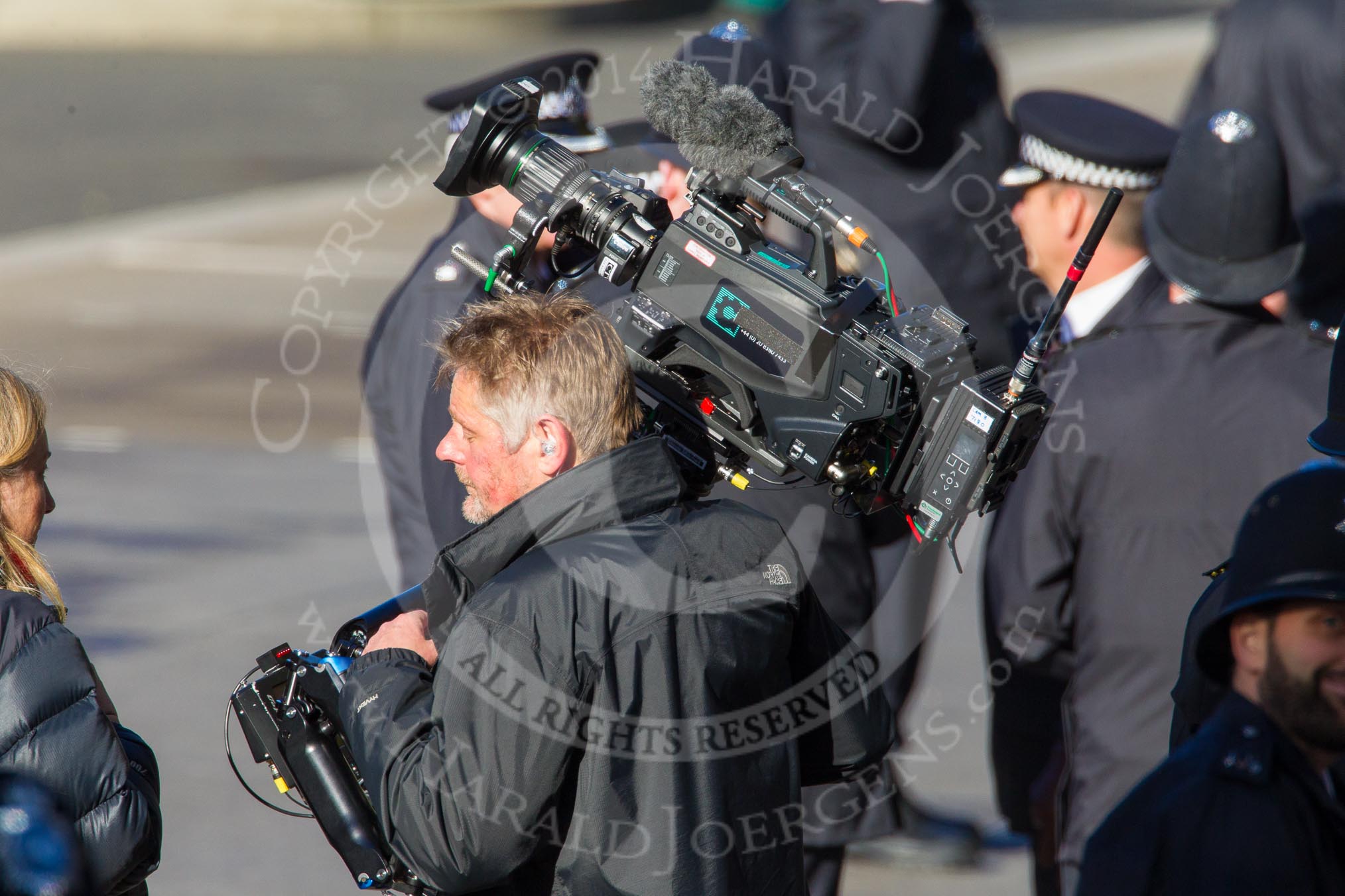 Photo 1411091224171D40716HaraldJoergens Remembrance Sunday at the Cenotaph in London 2014: After the March Past (see March Pastimage library): The stedycam operator for the BBC after carrying the 30kg camera during the complete March Past.
Press stand opposite the Foreign Office building, Whitehall, London SW1,
London,
Greater London,
United Kingdom,
on 09 November 2014 at 12:24, image #316