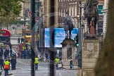 Remembrance Sunday at the Cenotaph in London 2014: The eastern end of Whitehall with one of the big television screens and a strong police presence..
Press stand opposite the Foreign Office building, Whitehall, London SW1,
London,
Greater London,
United Kingdom,
on 09 November 2014 at 08:03, image #2
