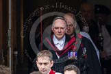Remembrance Sunday at the Cenotaph in London 2014: The Serjeant of the Vestry, David Baldin, leaving the Foreign- and Commonwealth Office, followed by the Chaplain General to Her Majesty’s Land Forces, the Sub-Dean of Her Majesty’s Chapels Royal, and the Dean of HM Chapels Royal, the Bishop of London.
Press stand opposite the Foreign Office building, Whitehall, London SW1,
London,
Greater London,
United Kingdom,
on 09 November 2014 at 10:53, image #99