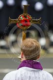 Remembrance Sunday at the Cenotaph in London 2014: The cross bearer with the cross.
Press stand opposite the Foreign Office building, Whitehall, London SW1,
London,
Greater London,
United Kingdom,
on 09 November 2014 at 10:55, image #120