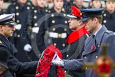 Remembrance Sunday at the Cenotaph in London 2014: Lieutenant James Benbow, Royal Navy, equerry to HRH The Duke of Cambridge, handing over the wreath to Prince William.
Press stand opposite the Foreign Office building, Whitehall, London SW1,
London,
Greater London,
United Kingdom,
on 09 November 2014 at 11:05, image #201