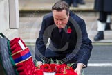 Remembrance Sunday at the Cenotaph in London 2014: The Prime Minister, the Rt Hon David Cameron, laying a wreath at the Cenotaph.
Press stand opposite the Foreign Office building, Whitehall, London SW1,
London,
Greater London,
United Kingdom,
on 09 November 2014 at 11:07, image #219