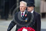 Remembrance Sunday at the Cenotaph in London 2014: Vice Admiral Peter Wilkinson, President of the Royal British Legion, walking towards the Cenotaph with his wreath.
Press stand opposite the Foreign Office building, Whitehall, London SW1,
London,
Greater London,
United Kingdom,
on 09 November 2014 at 11:26, image #302