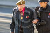 Remembrance Sunday at the Cenotaph in London 2014: An elderly gentleman lays a wreath, with thousands of spectators clapping.
Press stand opposite the Foreign Office building, Whitehall, London SW1,
London,
Greater London,
United Kingdom,
on 09 November 2014 at 12:43, image #328